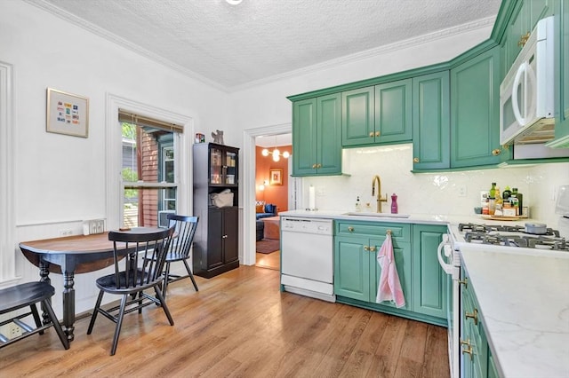 17 Teel St Unit 1, Arlington, MA 02474 - kitchen with white appliances, light countertops, a textured ceiling, light wood finished floors, and crown molding