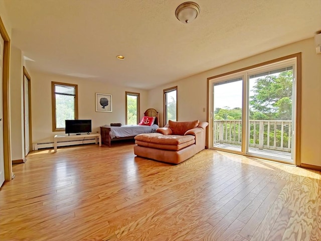 30 Norris Path, Falmouth, MA 02536 - living area with baseboard heating, light wood finished floors, baseboards, and recessed lighting