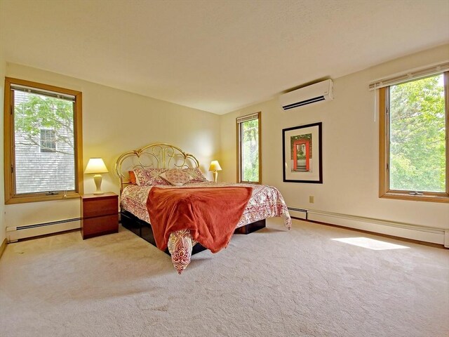 30 Norris Path, Falmouth, MA 02536 - carpeted bedroom with a baseboard heating unit, a wall mounted air conditioner, and multiple windows