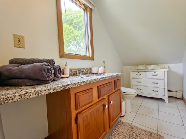 30 Norris Path, Falmouth, MA 02536 - bathroom with toilet, vanity, baseboard heating, vaulted ceiling, and tile patterned floors