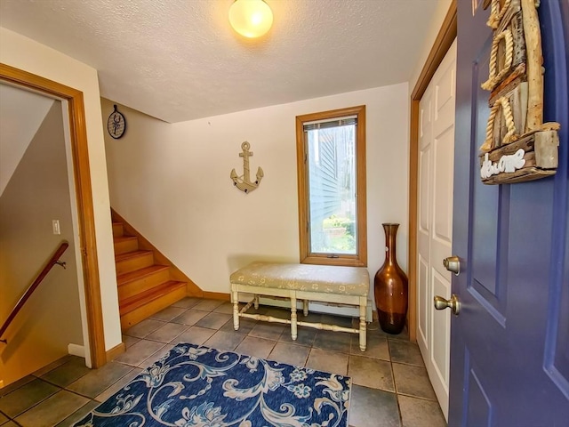 30 Norris Path, Falmouth, MA 02536 - foyer featuring stairway, a textured ceiling, tile patterned flooring, and baseboards