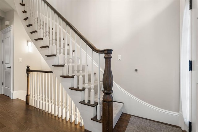 staircase featuring hardwood / wood-style flooring