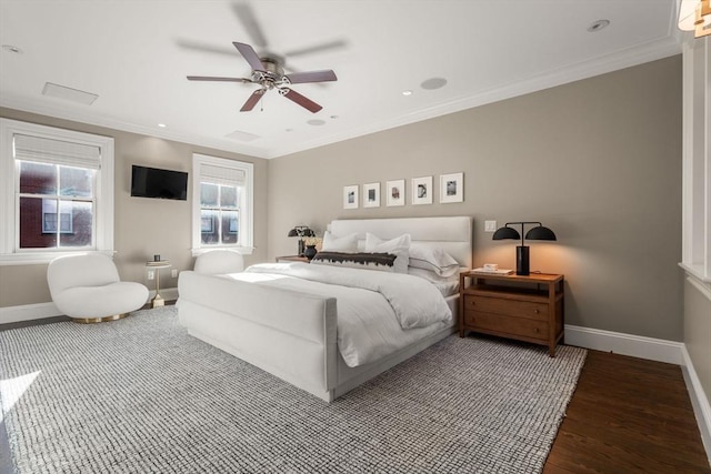 bedroom with ceiling fan, ornamental molding, and wood-type flooring