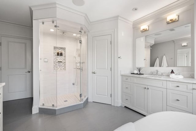 bathroom with crown molding, vanity, and plus walk in shower