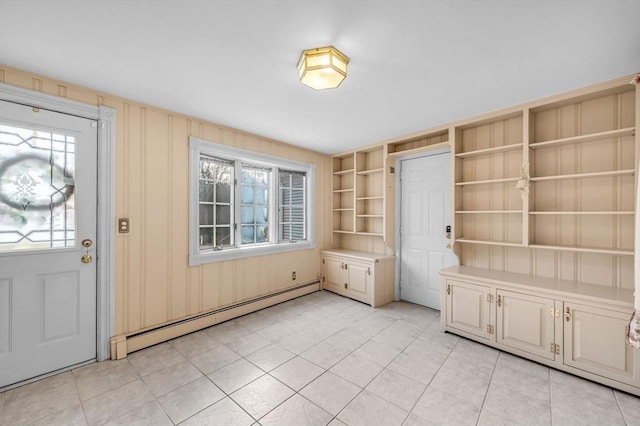 foyer with a healthy amount of sunlight and a baseboard radiator