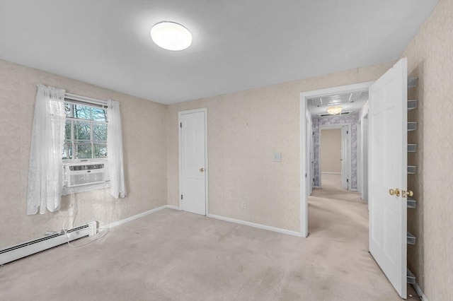 unfurnished bedroom with light carpet, a closet, a baseboard radiator, and cooling unit