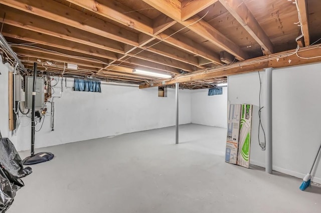 basement featuring electric panel