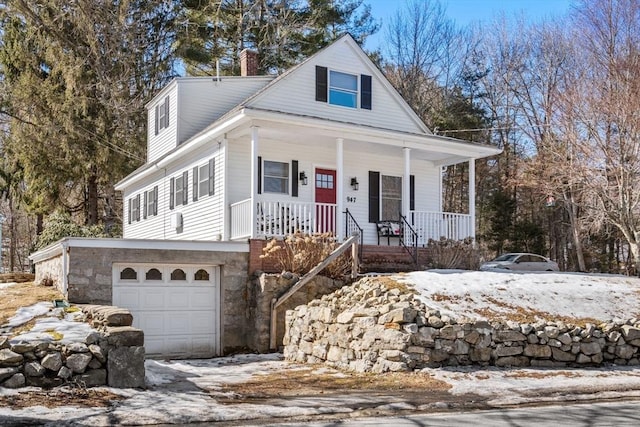 view of front of house featuring a porch, a chimney, and a garage