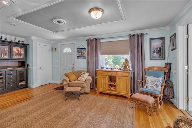 33 Dean St, Norton, MA 02766 - sitting room with light wood-style floors and crown molding