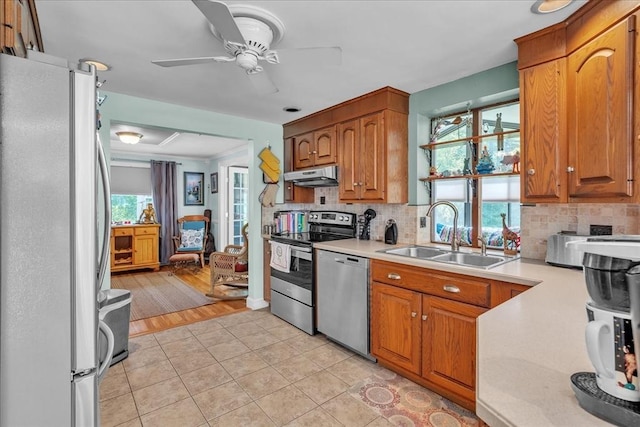 33 Dean St, Norton, MA 02766 - kitchen featuring stainless steel appliances, under cabinet range hood, healthy amount of natural light, and light countertops