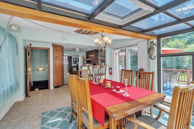 33 Dean St, Norton, MA 02766 - dining space with light tile patterned flooring, a chandelier, and a skylight