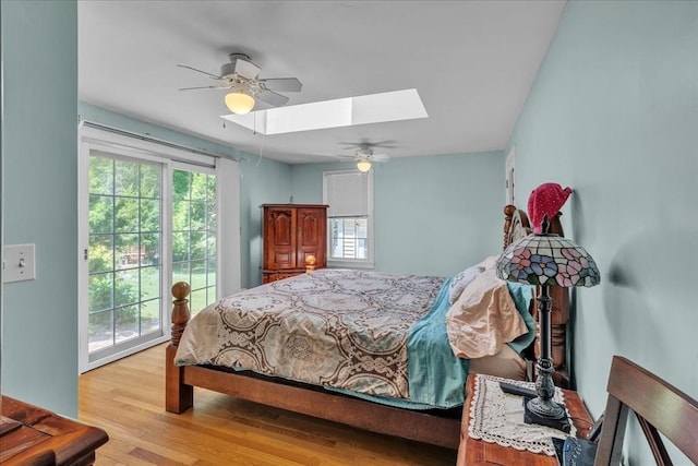 33 Dean St, Norton, MA 02766 - bedroom featuring a skylight, multiple windows, wood finished floors, and access to outside