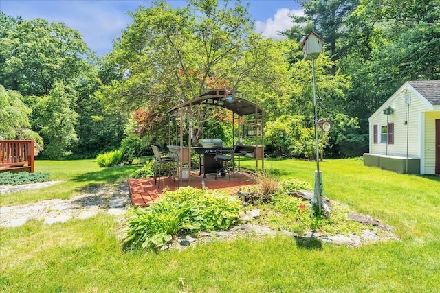 33 Dean St, Norton, MA 02766 - view of grassy yard with a wooden deck and an outbuilding