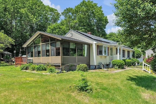 33 Dean St, Norton, MA 02766 - view of front of house featuring a sunroom, a front lawn, and a chimney
