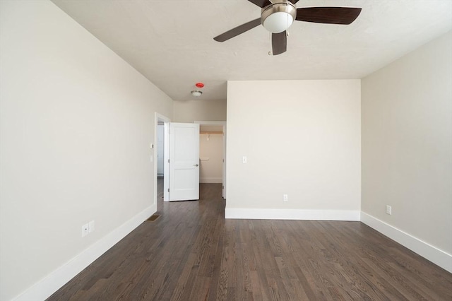 unfurnished room featuring dark hardwood / wood-style floors and ceiling fan