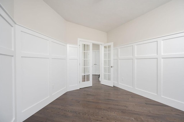 spacious closet featuring dark hardwood / wood-style flooring and french doors