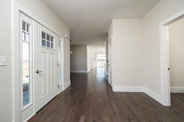 hallway with dark wood-type flooring