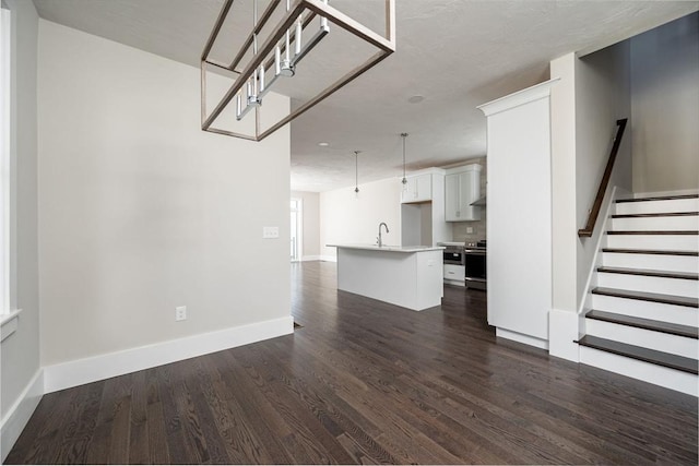 unfurnished living room with dark hardwood / wood-style flooring