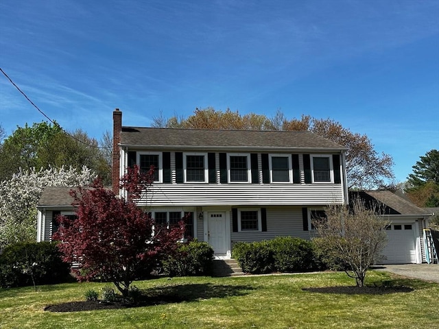 46 Frairy St, Medfield, MA 02052 - colonial inspired home with a chimney, a front lawn, an attached garage, and driveway