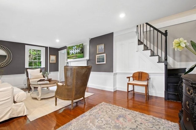 38 S St, Grafton, MA 01519 - living room with stairs, wood finished floors, a wainscoted wall, and a decorative wall