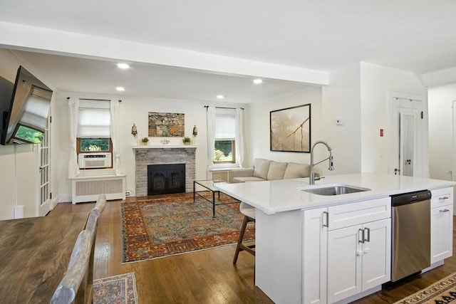 182 Winn St, Woburn, MA 01801 - kitchen with stainless steel dishwasher, radiator heating unit, dark wood-type flooring, light countertops, and open floor plan