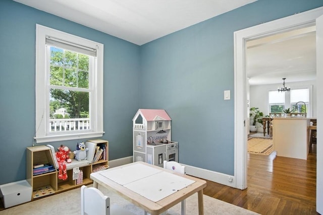 182 Winn St, Woburn, MA 01801 - rec room with a chandelier and wood finished floors