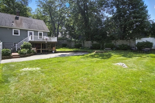 182 Winn St, Woburn, MA 01801 - view of yard featuring a deck, stairway, and a patio