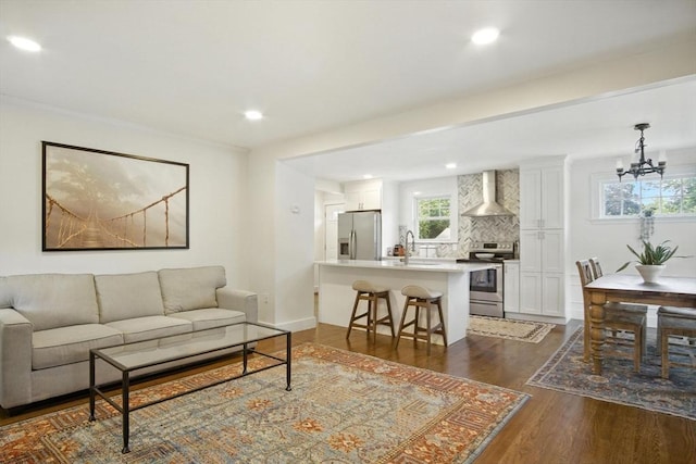 182 Winn St, Woburn, MA 01801 - living area featuring a chandelier, dark wood-style flooring, and recessed lighting