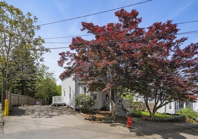 view of front of property featuring fence