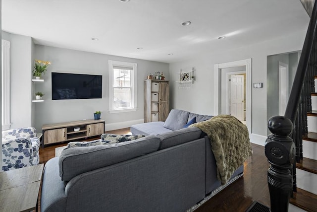living area featuring wood finished floors, baseboards, and recessed lighting