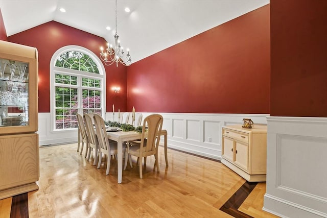 42 High St, Freetown, MA 02702 - dining room with lofted ceiling, a wainscoted wall, a chandelier, light wood finished floors, and a decorative wall