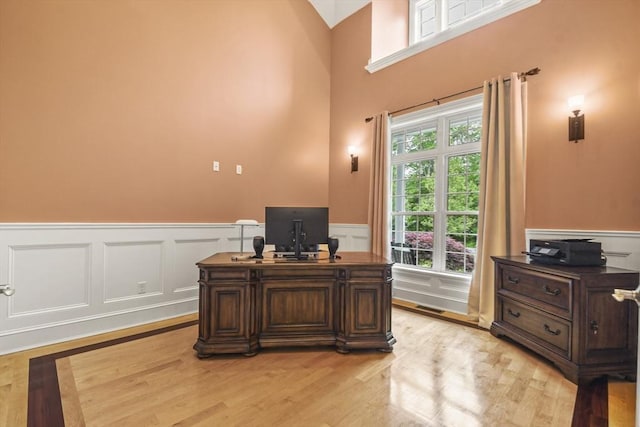 42 High St, Freetown, MA 02702 - office featuring wainscoting, light wood-style floors, and a decorative wall