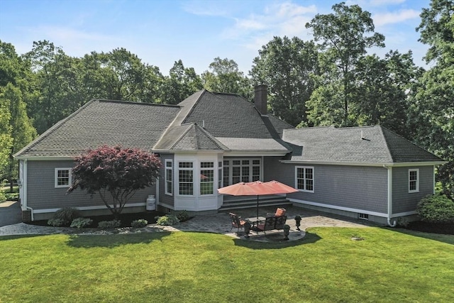 42 High St, Freetown, MA 02702 - rear view of house featuring a patio, a yard, roof with shingles, and a chimney