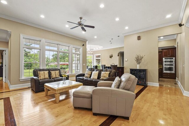 42 High St, Freetown, MA 02702 - living room featuring healthy amount of natural light, ornamental molding, a ceiling fan, light wood finished floors, and recessed lighting