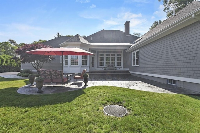 42 High St, Freetown, MA 02702 - back of property featuring a patio area, a chimney, and a lawn