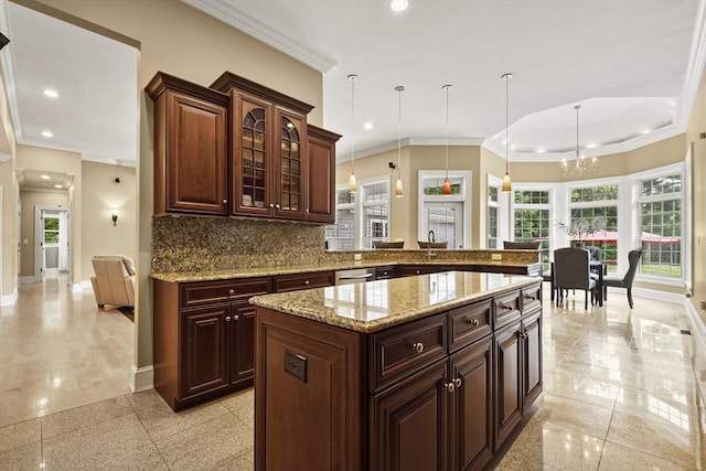 42 High St, Freetown, MA 02702 - kitchen with ornamental molding, recessed lighting, tasteful backsplash, light stone counters, and decorative light fixtures