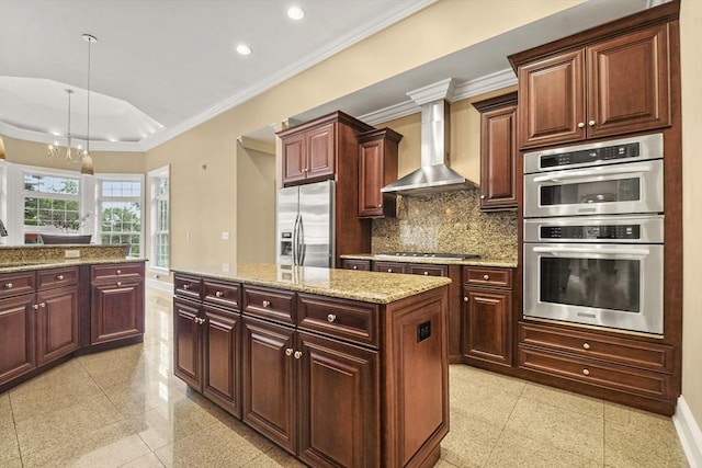 42 High St, Freetown, MA 02702 - kitchen featuring appliances with stainless steel finishes, wall chimney exhaust hood, crown molding, a kitchen island, and recessed lighting