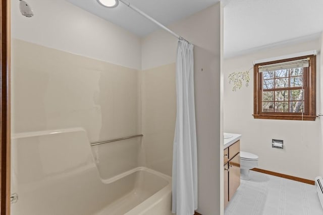 bathroom featuring toilet, vanity, baseboards, baseboard heating, and tile patterned floors