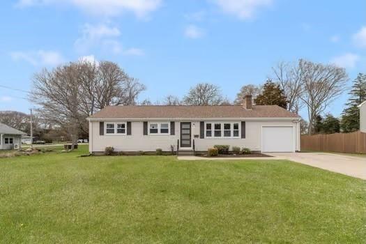 50 Riverview Ave, Westerly, RI 02891 - ranch-style home with a garage, a front lawn, a chimney, and driveway