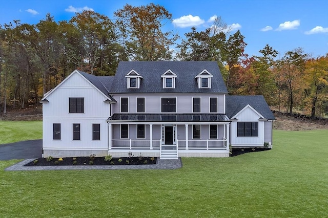 back of house featuring a yard and a porch