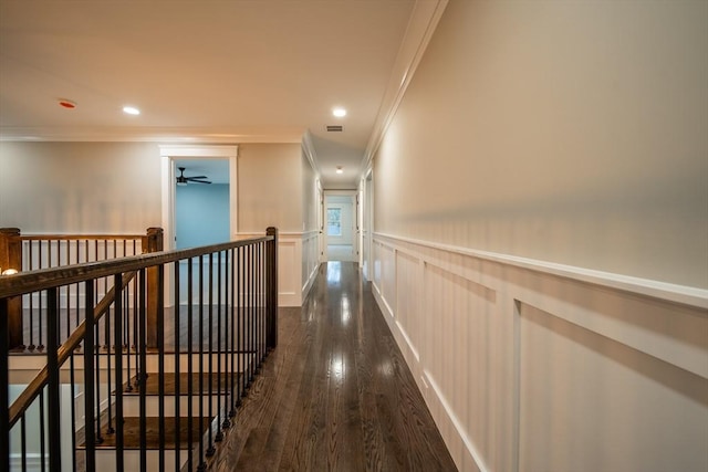 hall with crown molding and dark wood-type flooring