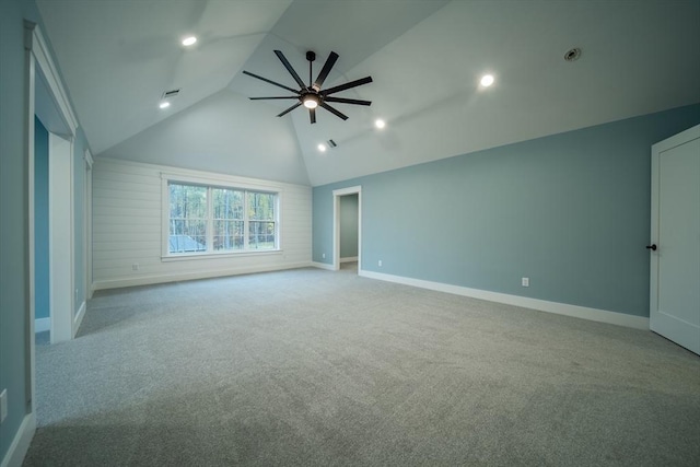 interior space featuring light colored carpet and high vaulted ceiling