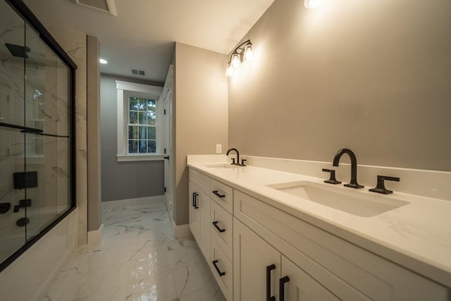 bathroom featuring vanity and enclosed tub / shower combo