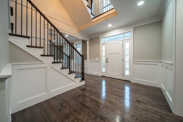 entrance foyer featuring dark hardwood / wood-style floors and ornamental molding