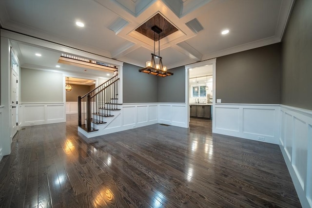 unfurnished room with crown molding, sink, and dark hardwood / wood-style floors