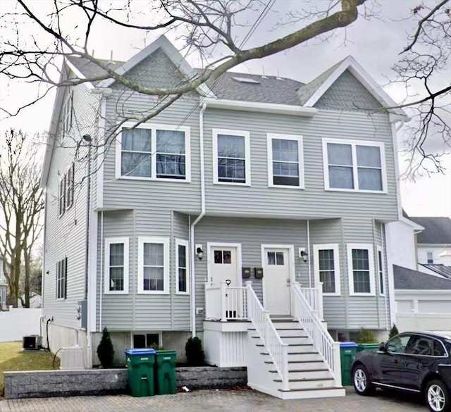 view of front of house with central air condition unit