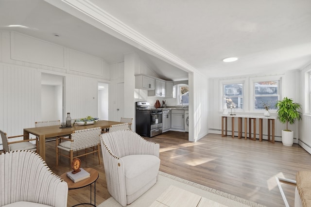 living room featuring hardwood / wood-style floors and a baseboard radiator