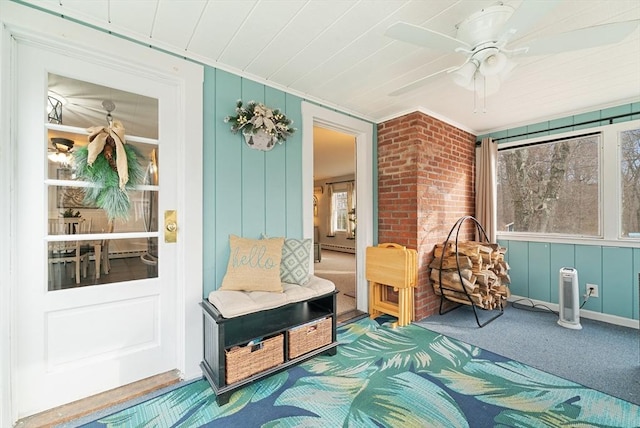 sunroom with ceiling fan