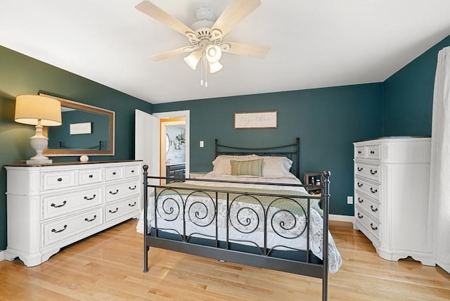 bedroom with light hardwood / wood-style floors and ceiling fan