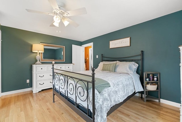 bedroom with ceiling fan and light hardwood / wood-style flooring